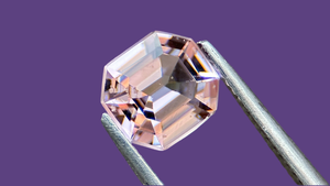 Exquisite lavender-coloured natural spinel gemstone, beautifully cut with an elegant faceting style, set against a regal purple background. Perfect for unique fine jewellery designs, ethically sourced and ideal for collectors of rare gemstones.