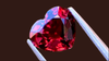 Brilliant 1-carat orangey-red heart-shaped spinel gemstone, featuring exquisite sparkle and clarity, ethically sourced for luxury jewellery designs.