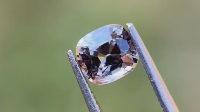 Light grey natural spinel, cushion cut, showcasing its refined colour and shape. Perfect for custom jewellery.