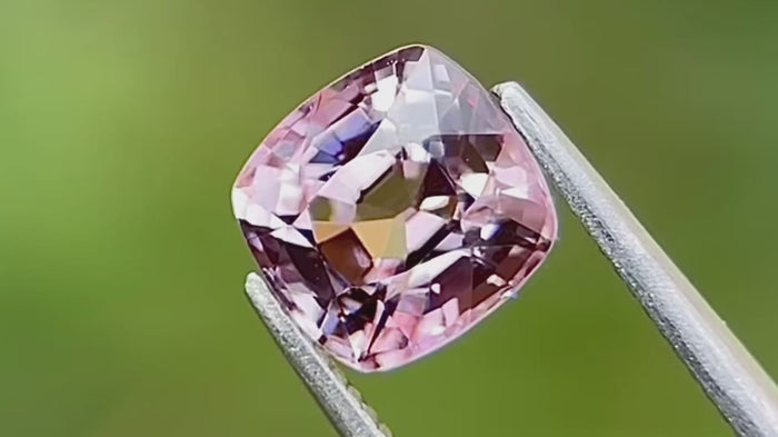 Natural cushion-cut spinel gemstone in lavender colour, hand-cut from Mogok, Myanmar (Burma), displayed against a plain background.