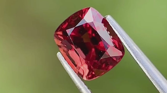 Burma origin, Red-Orangish Spinel, weighing 2.20 carats and boasting exceptional eye-clean clarity.