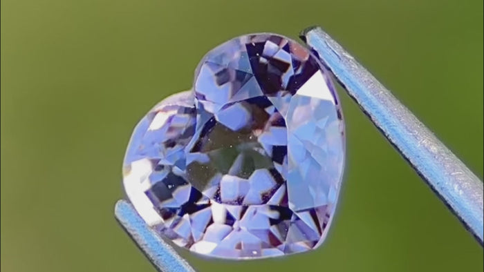 Affordable luxury in a 1.20-carat lavender Burmese spinel gemstone, ethically sourced. Hand-cut heart shape with vibrant sparkle, ideal for custom fine jewellery pieces.