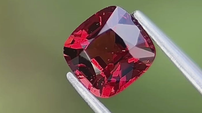 Cushion-cut red natural spinel, Mogok origin, showcasing its vibrant colour and brilliance, ideal for custom fine jewellery.