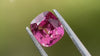 Bright pink untreated spinel, cushion-cut, shown with tweezers. Ideal for bespoke jewellery. Ethically sourced.