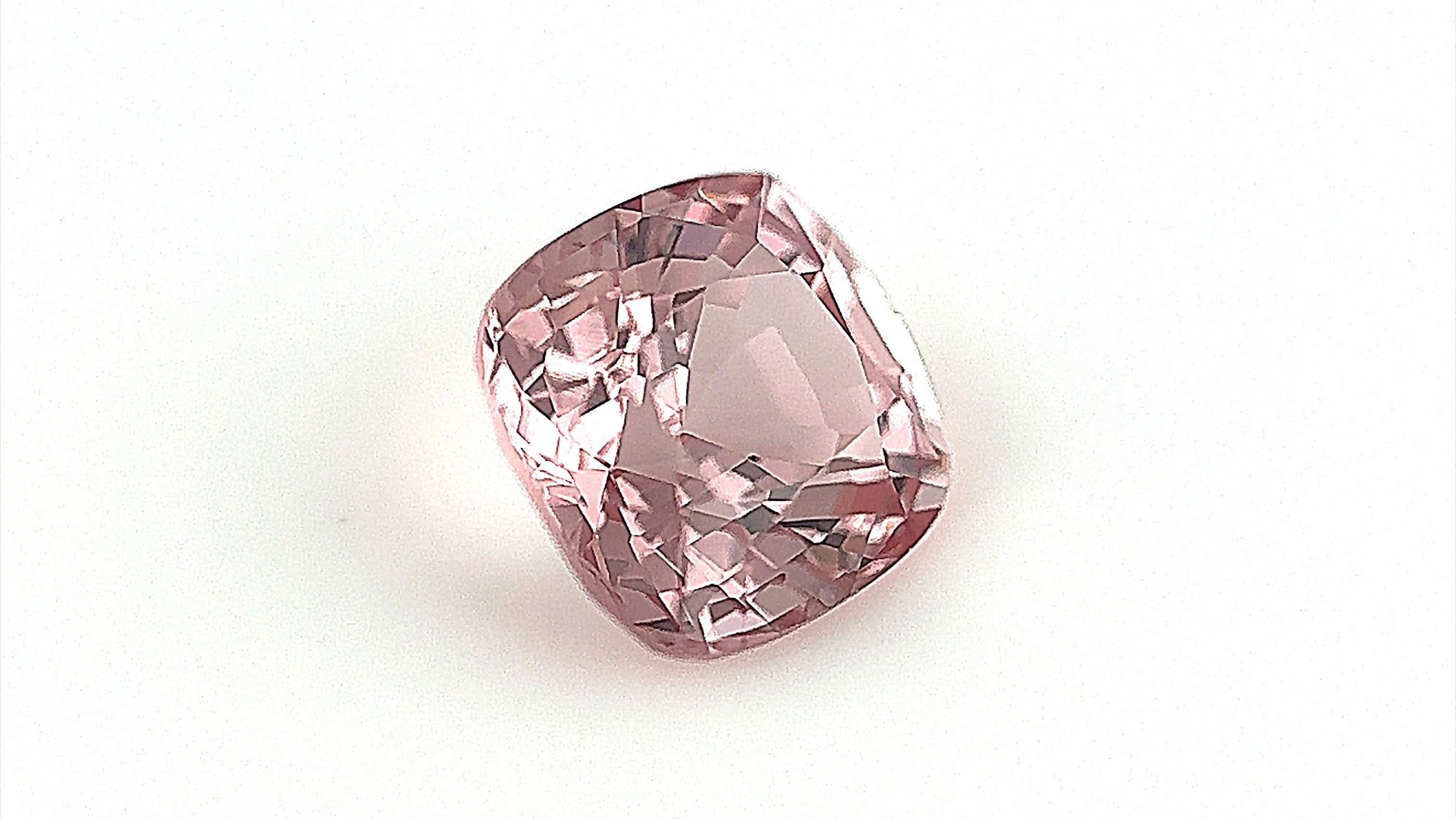 Unique 1.78-carat pale brown natural spinel, cushion-cut, dimensions 7x6.7x4.7mm. Photographed indoors with a gemlight box to enhance its rare colour and clarity, suitable for bespoke fine jewellery.